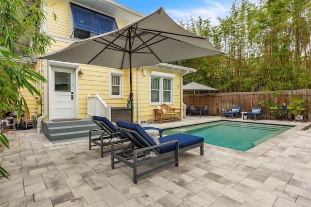 221 13th Ave NE, Saint Petersburg, FL 33701 - view of swimming pool featuring fence and a patio