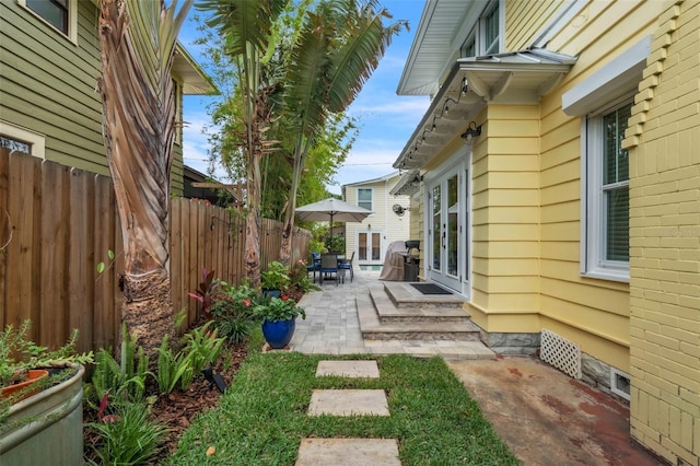 221 13th Ave NE, Saint Petersburg, FL 33701 - view of yard with a patio, fence, and french doors