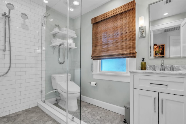 221 13th Ave NE, Saint Petersburg, FL 33701 - bathroom featuring toilet, a tile shower, vanity, tile patterned flooring, and recessed lighting