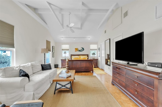221 13th Ave NE, Saint Petersburg, FL 33701 - living area featuring plenty of natural light, light wood-style floors, a ceiling fan, beamed ceiling, and high vaulted ceiling