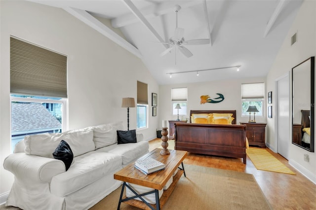 221 13th Ave NE, Saint Petersburg, FL 33701 - living area featuring ceiling fan, baseboards, and track lighting