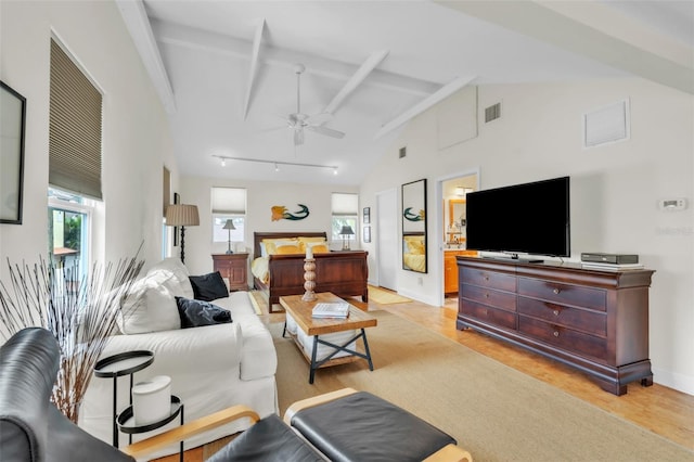 221 13th Ave NE, Saint Petersburg, FL 33701 - living room featuring a ceiling fan, high vaulted ceiling, baseboards, light wood-type flooring, and beamed ceiling