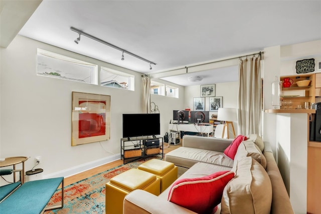 221 13th Ave NE, Saint Petersburg, FL 33701 - living area with track lighting, baseboards, and wood finished floors