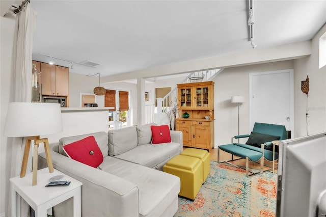 221 13th Ave NE, Saint Petersburg, FL 33701 - living room with rail lighting and stairs