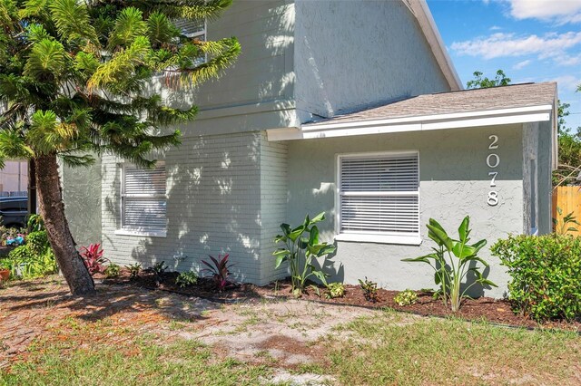 2078 Madrid Ct N, Clearwater, FL 33763 - view of property exterior featuring brick siding