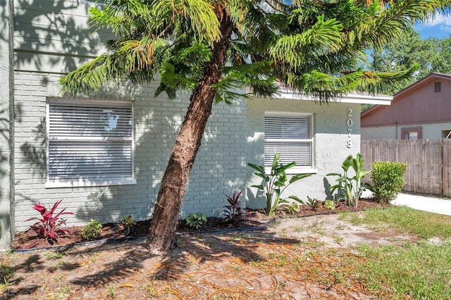 2078 Madrid Ct N, Clearwater, FL 33763 - view of property exterior with fence and brick siding