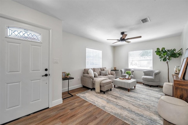 2078 Madrid Ct N, Clearwater, FL 33763 - living room with wood finished floors, ceiling fan, and baseboards