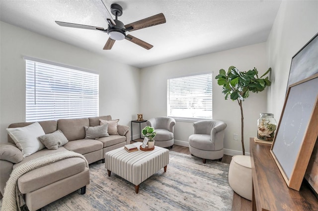 2078 Madrid Ct N, Clearwater, FL 33763 - living area featuring wood finished floors, a ceiling fan, baseboards, and a textured ceiling