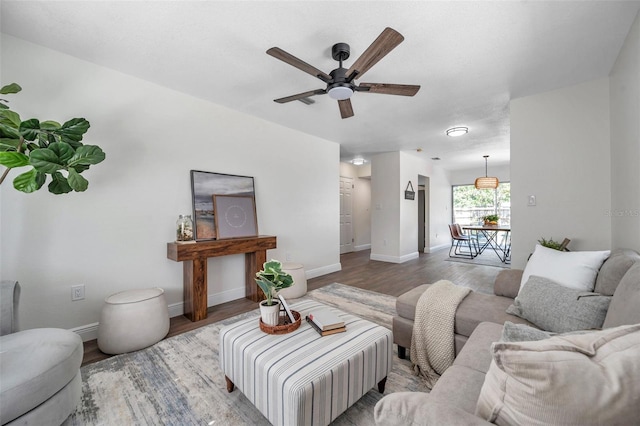2078 Madrid Ct N, Clearwater, FL 33763 - living area with a ceiling fan, wood finished floors, and baseboards