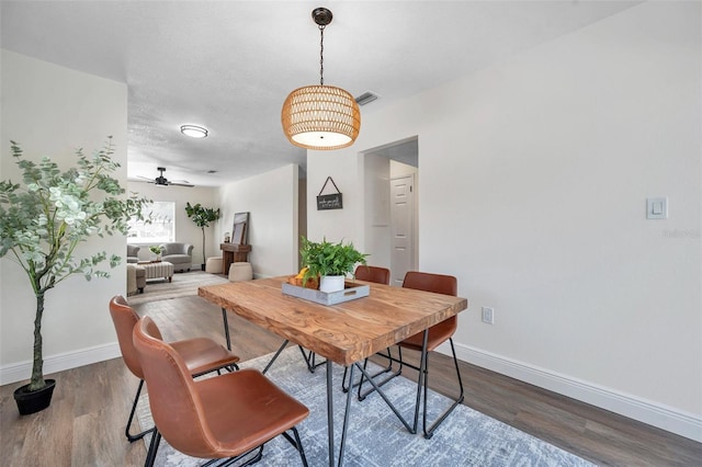 2078 Madrid Ct N, Clearwater, FL 33763 - dining space with dark wood-style flooring, baseboards, and ceiling fan