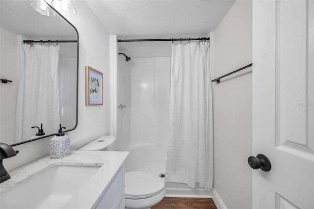 2078 Madrid Ct N, Clearwater, FL 33763 - bathroom featuring toilet, a shower with shower curtain, vanity, wood finished floors, and a textured ceiling