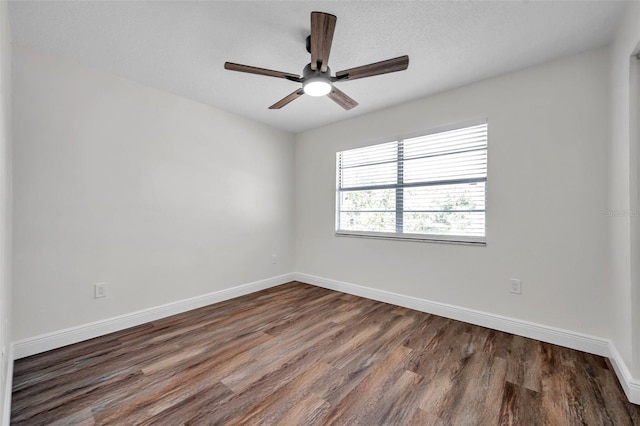 2078 Madrid Ct N, Clearwater, FL 33763 - empty room featuring wood finished floors, a ceiling fan, and baseboards