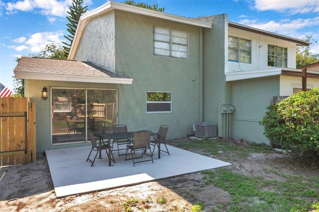 2078 Madrid Ct N, Clearwater, FL 33763 - back of house featuring stucco siding, a patio area, and cooling unit