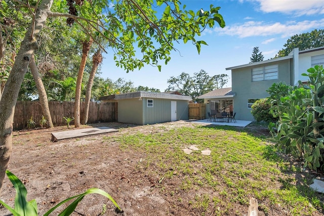 2078 Madrid Ct N, Clearwater, FL 33763 - fenced backyard with a patio and an outdoor structure