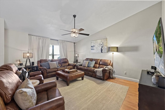 1914 Elk Spring Dr, Brandon, FL 33511 - living room with a ceiling fan, light wood-type flooring, baseboards, and lofted ceiling