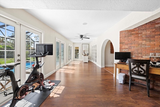 1914 Elk Spring Dr, Brandon, FL 33511 - workout room featuring french doors, baseboards, hardwood / wood-style floors, and arched walkways