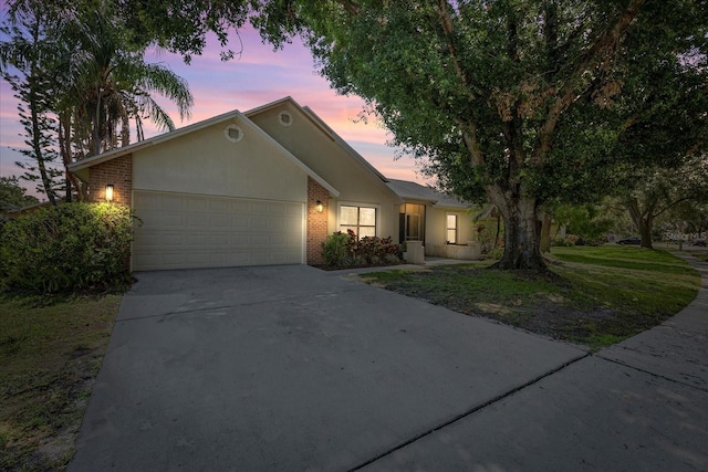1914 Elk Spring Dr, Brandon, FL 33511 - ranch-style house featuring brick siding, a garage, and concrete driveway