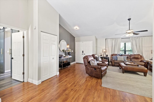 1914 Elk Spring Dr, Brandon, FL 33511 - living area featuring light wood finished floors, baseboards, a ceiling fan, and high vaulted ceiling