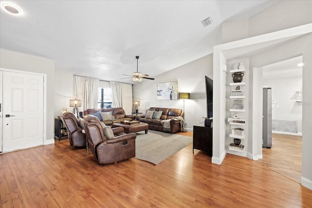 1914 Elk Spring Dr, Brandon, FL 33511 - living area featuring light wood-style flooring, a ceiling fan, vaulted ceiling, and baseboards
