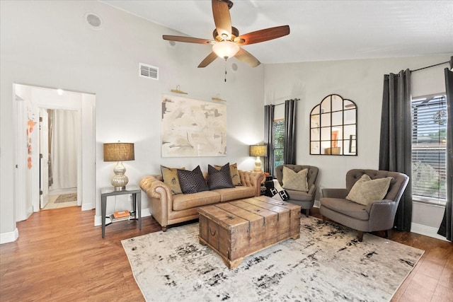 1914 Elk Spring Dr, Brandon, FL 33511 - living room with ceiling fan, wood finished floors, baseboards, and high vaulted ceiling