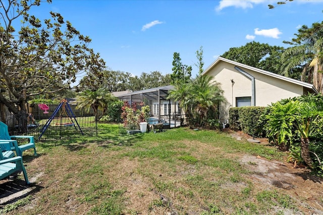 1914 Elk Spring Dr, Brandon, FL 33511 - view of yard featuring glass enclosure and a playground