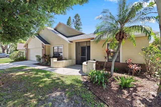 1914 Elk Spring Dr, Brandon, FL 33511 - ranch-style house featuring a garage, driveway, stucco siding, and roof with shingles