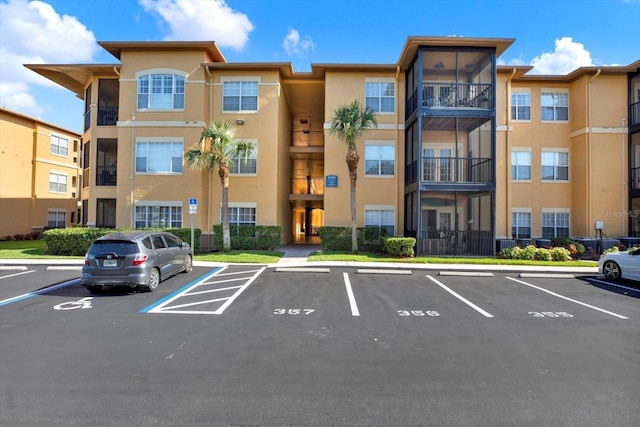 4333 Bayside Village Dr Unit 110, Tampa, FL 33615 - view of apartment building / complex featuring uncovered parking