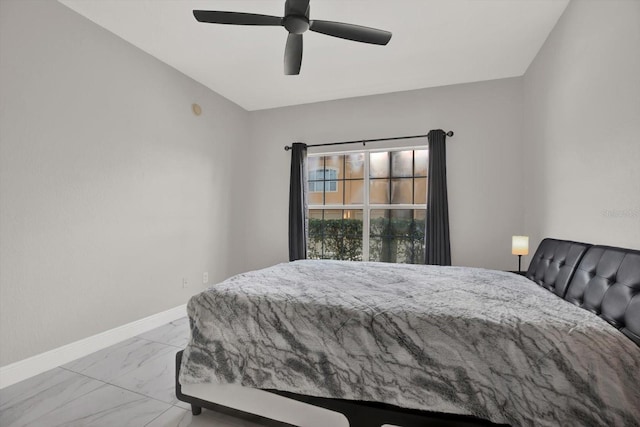 4333 Bayside Village Dr Unit 110, Tampa, FL 33615 - bedroom with marble look tiles, baseboards, and ceiling fan