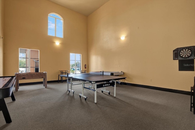 4333 Bayside Village Dr Unit 110, Tampa, FL 33615 - game room featuring carpet flooring, baseboards, and a towering ceiling