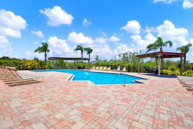 4333 Bayside Village Dr Unit 110, Tampa, FL 33615 - community pool featuring a pergola, fence, and a patio