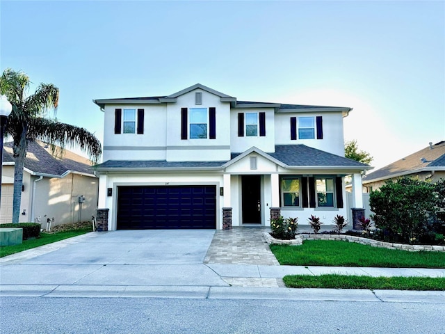 1147 Halapa Way, Trinity, FL 34655 - view of front of house featuring stucco siding, an attached garage, and driveway