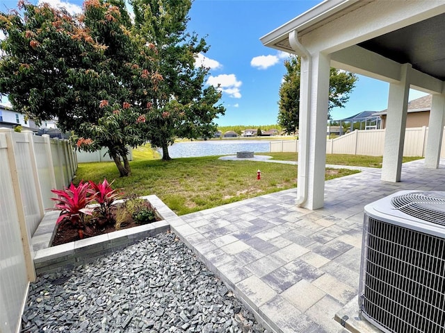 1147 Halapa Way, Trinity, FL 34655 - view of patio / terrace with a water view and central AC unit
