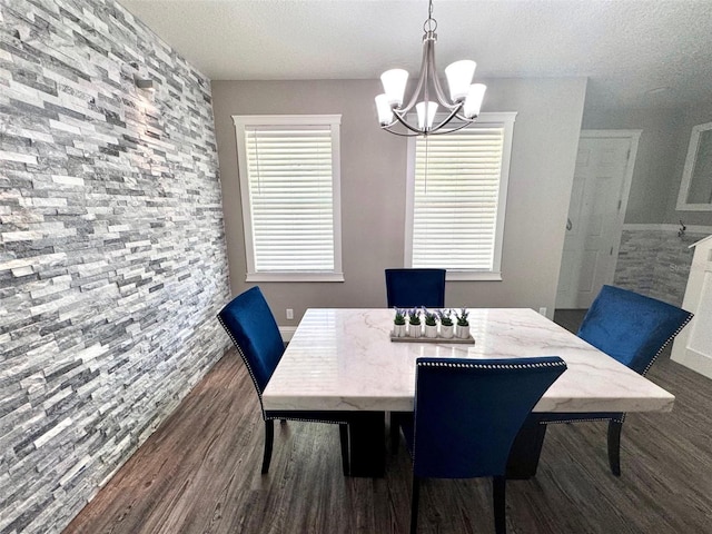 1147 Halapa Way, Trinity, FL 34655 - dining area with a chandelier, dark wood finished floors, and a textured ceiling