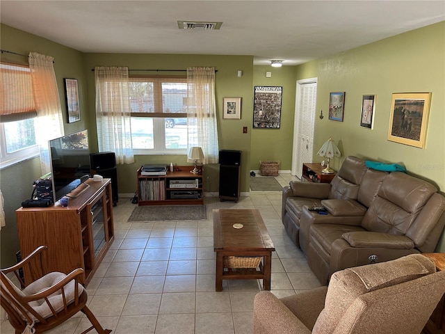 3827 15th Ave N, Saint Petersburg, FL 33713 - living room featuring healthy amount of natural light and light tile patterned floors