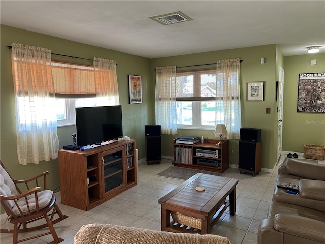 3827 15th Ave N, Saint Petersburg, FL 33713 - living area with light tile patterned floors and baseboards