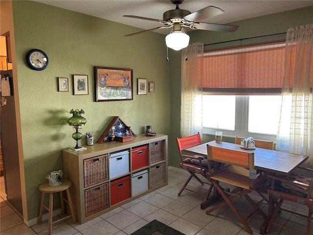3827 15th Ave N, Saint Petersburg, FL 33713 - dining space featuring a textured wall, light tile patterned flooring, ceiling fan, and baseboards