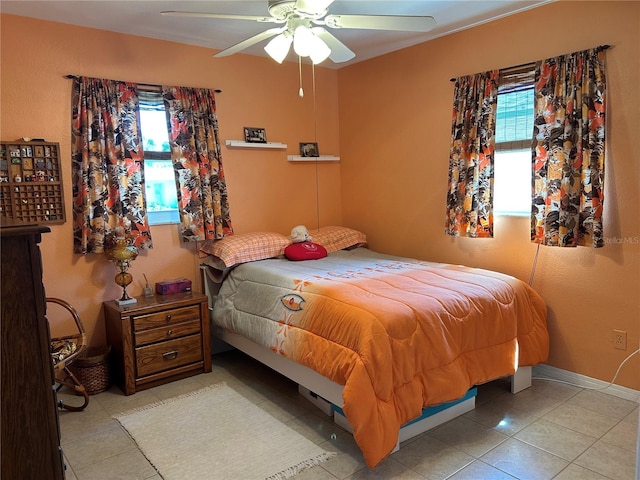 3827 15th Ave N, Saint Petersburg, FL 33713 - tiled bedroom with multiple windows and a ceiling fan