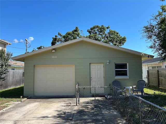 3827 15th Ave N, Saint Petersburg, FL 33713 - view of front of home featuring fence, driveway, and a garage