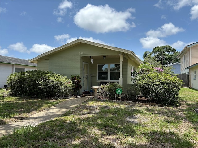 3827 15th Ave N, Saint Petersburg, FL 33713 - view of front of house with brick siding and a front lawn