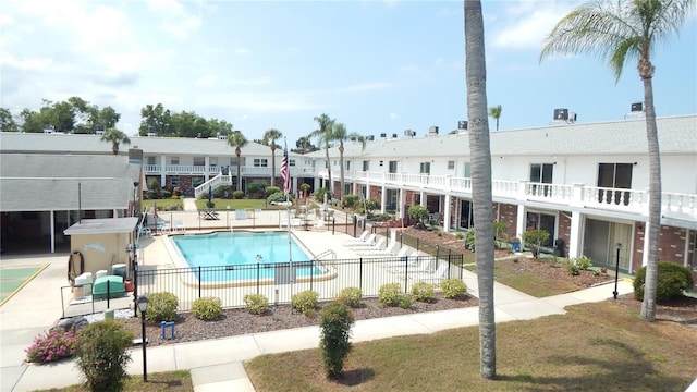 4744 Azalea Dr Unit 203B, New Port Richey, FL 34652 - community pool featuring fence and a patio