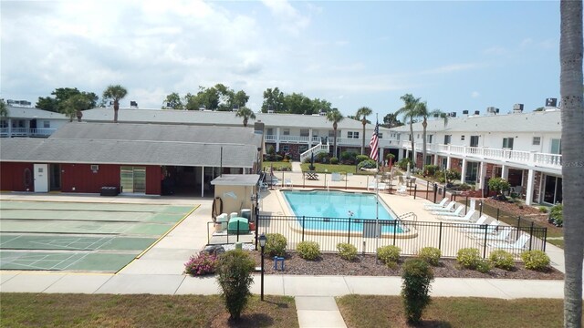 4744 Azalea Dr Unit 203B, New Port Richey, FL 34652 - community pool with fence, shuffleboard, and a patio