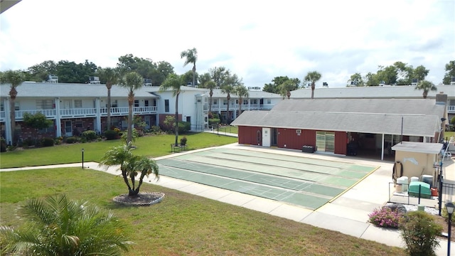 4744 Azalea Dr Unit 203B, New Port Richey, FL 34652 - view of home's community featuring shuffleboard and a lawn