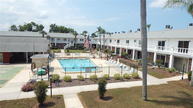 4744 Azalea Dr Unit 203B, New Port Richey, FL 34652 - community pool featuring fence, a patio area, and a residential view