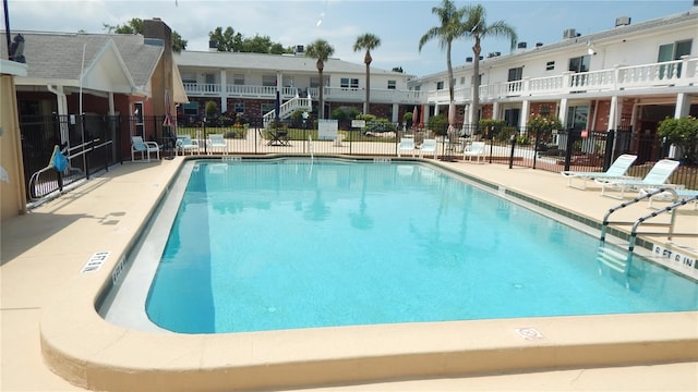 4744 Azalea Dr Unit 203B, New Port Richey, FL 34652 - community pool with fence and a patio