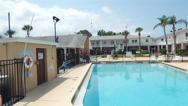 4744 Azalea Dr Unit 203B, New Port Richey, FL 34652 - community pool with fence and a patio