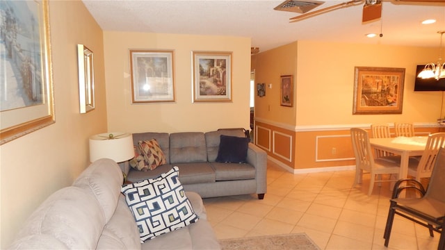 4744 Azalea Dr Unit 203B, New Port Richey, FL 34652 - living area featuring a ceiling fan, light tile patterned floors, a wainscoted wall, a chandelier, and recessed lighting