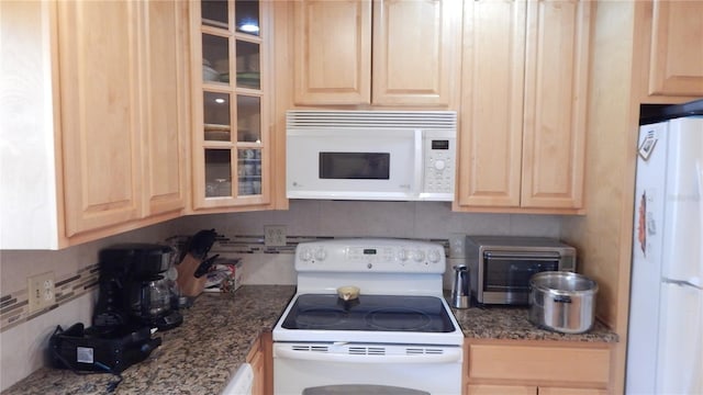 4744 Azalea Dr Unit 203B, New Port Richey, FL 34652 - kitchen with white appliances and light brown cabinetry