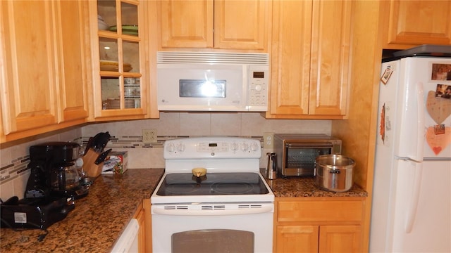 4744 Azalea Dr Unit 203B, New Port Richey, FL 34652 - kitchen featuring white appliances, decorative backsplash, and glass insert cabinets