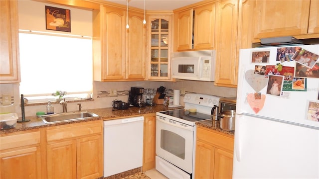 4744 Azalea Dr Unit 203B, New Port Richey, FL 34652 - kitchen featuring white appliances, a sink, light brown cabinets, glass insert cabinets, and dark stone countertops