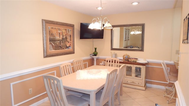 4744 Azalea Dr Unit 203B, New Port Richey, FL 34652 - tiled dining area with a chandelier and a wainscoted wall